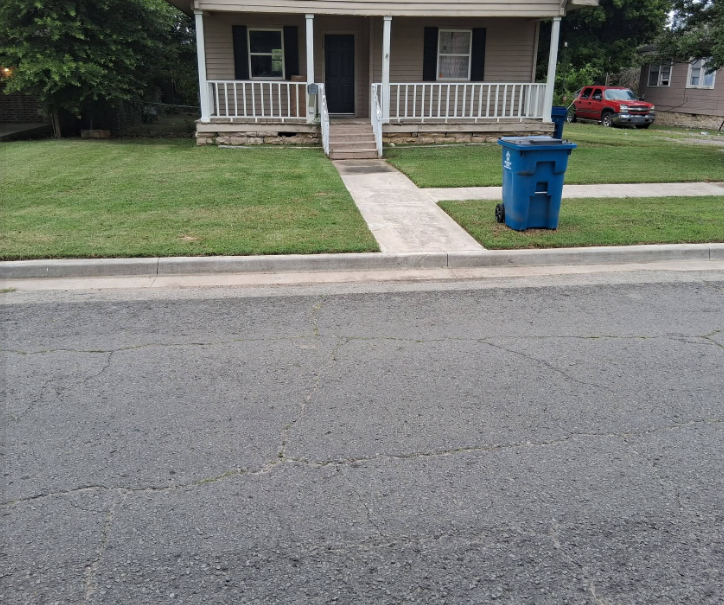 Freshly mowed and edged front yard with crisp walkway lines