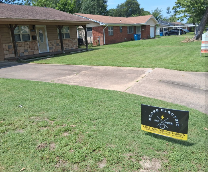 Neighborhood front yard mowed and edged along a concrete driveway